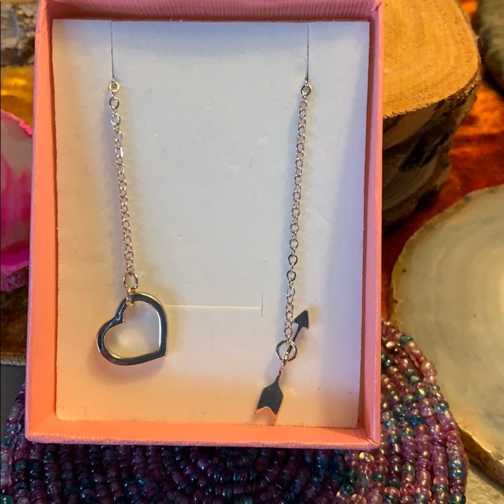 Silver heart arrow fits in heart